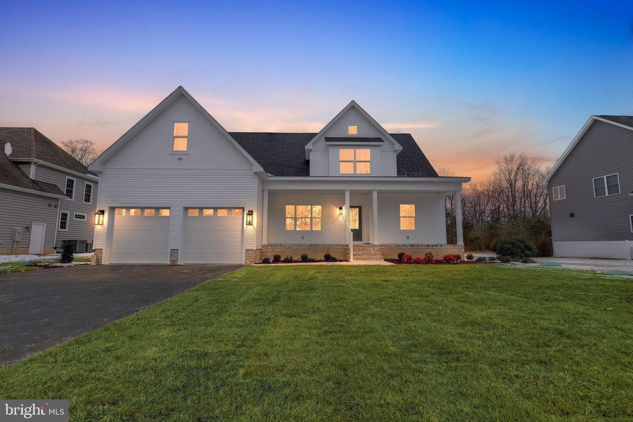 27458 Mooring Way Salisbury, MD 21801 - Photo 2 of 32 a front view of a house with a yard