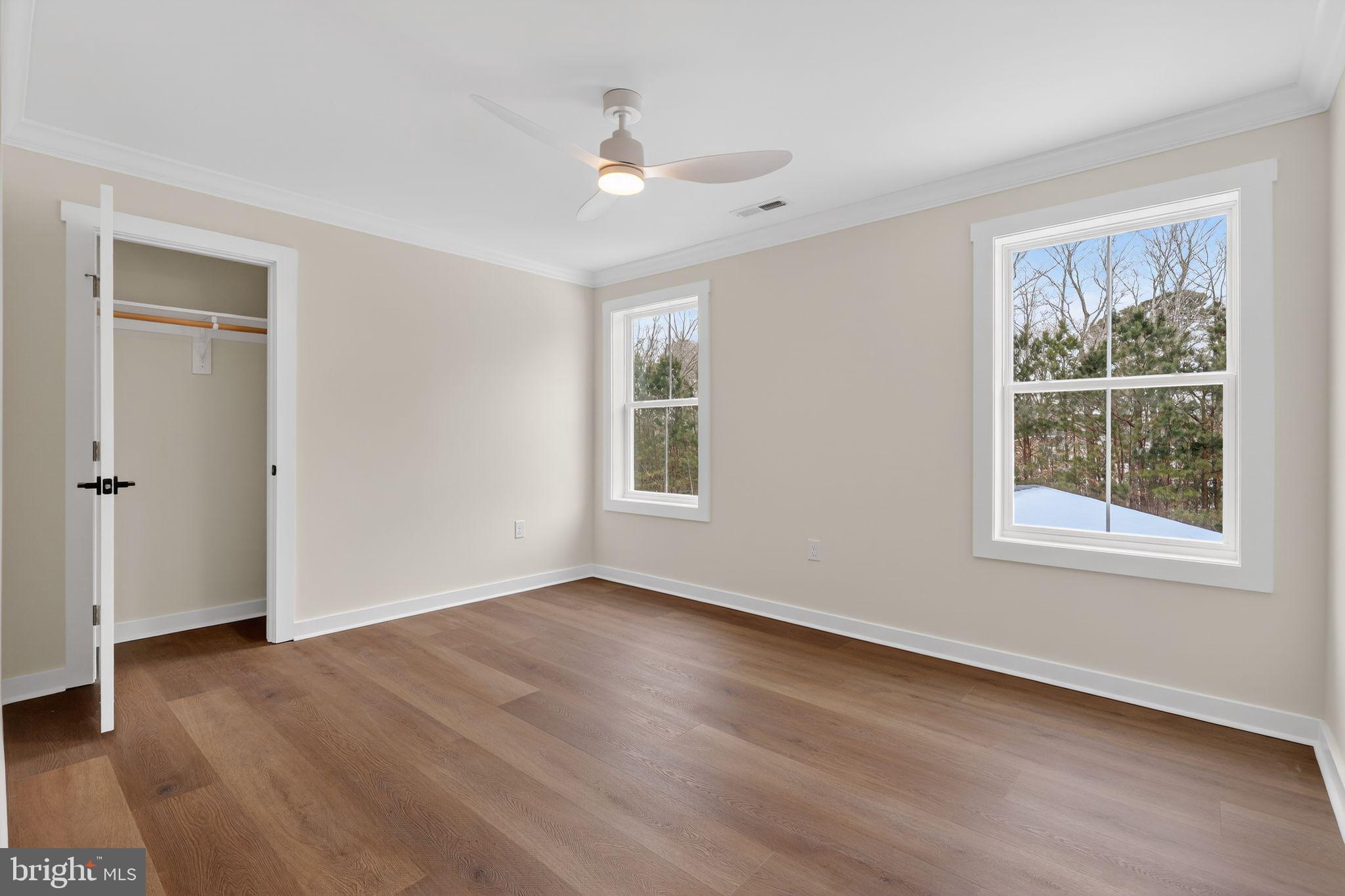 27458 Mooring Way Salisbury, MD 21801 - Photo 25 of 32 a view of an empty room with wooden floor and a window