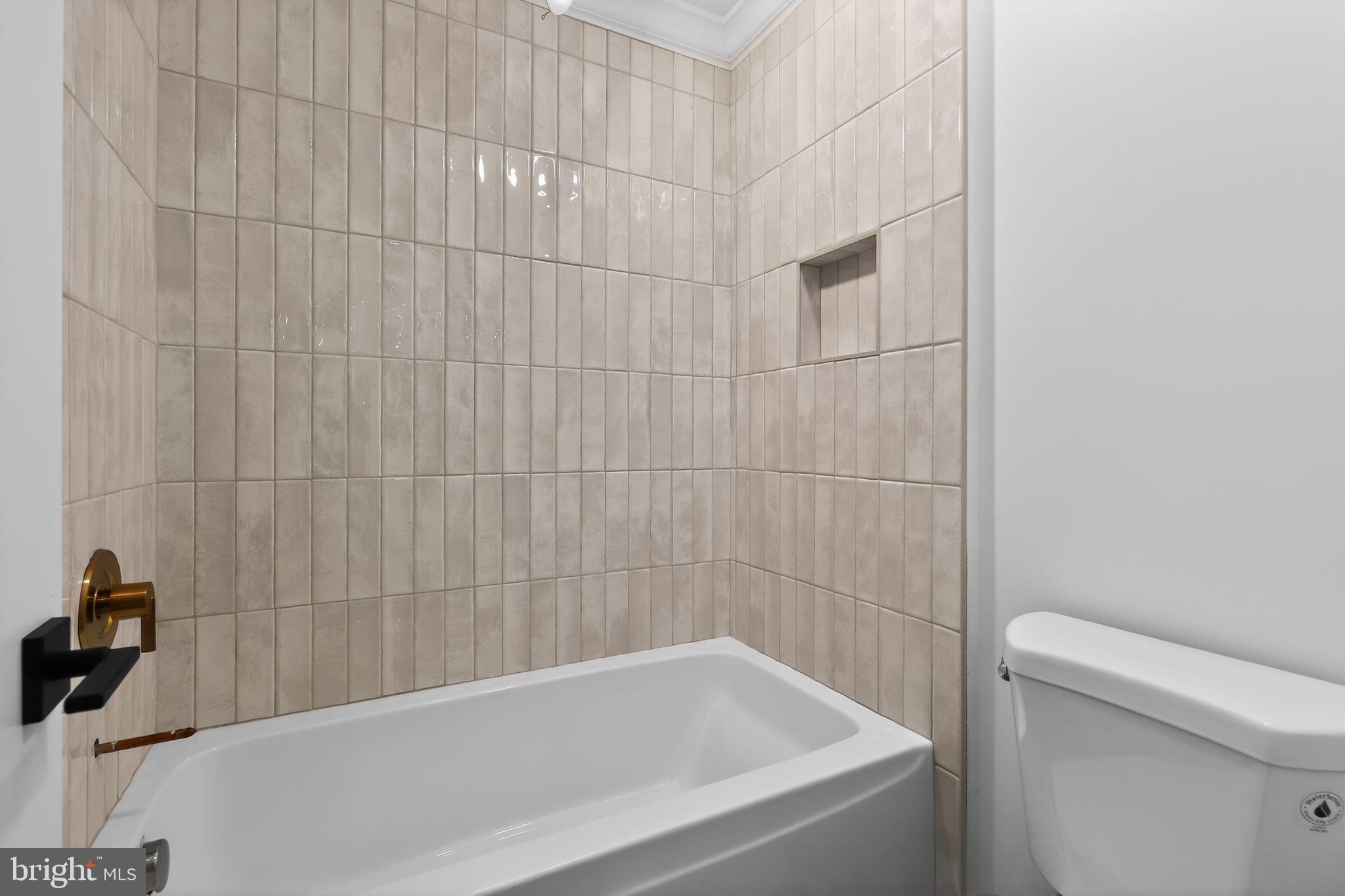 27458 Mooring Way Salisbury, MD 21801 - Photo 28 of 32 a bathroom with a bathtub and a toilet