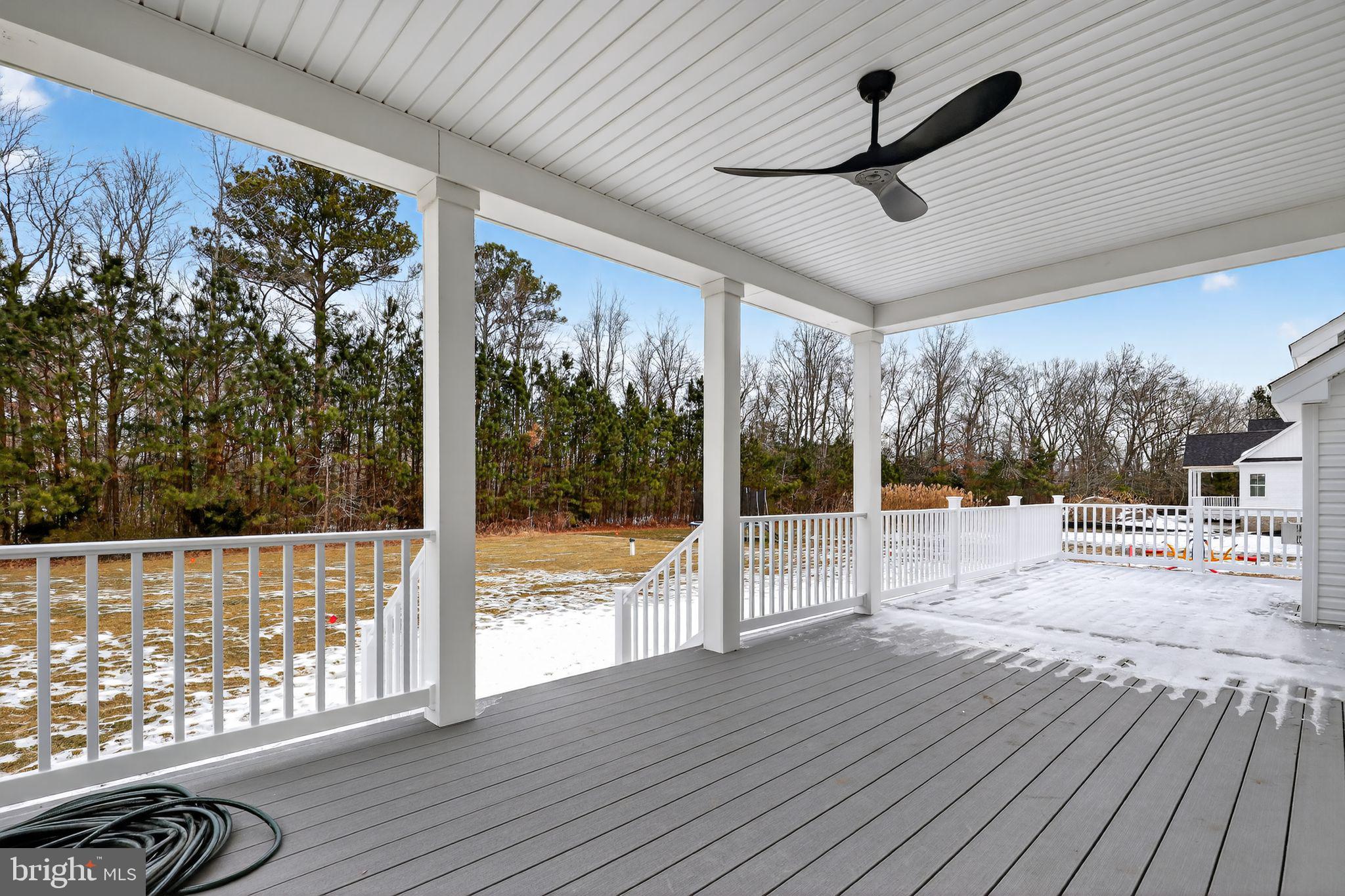 27458 Mooring Way Salisbury, MD 21801 - Photo 3 of 32 a view of a porch with wooden floor and outdoor space