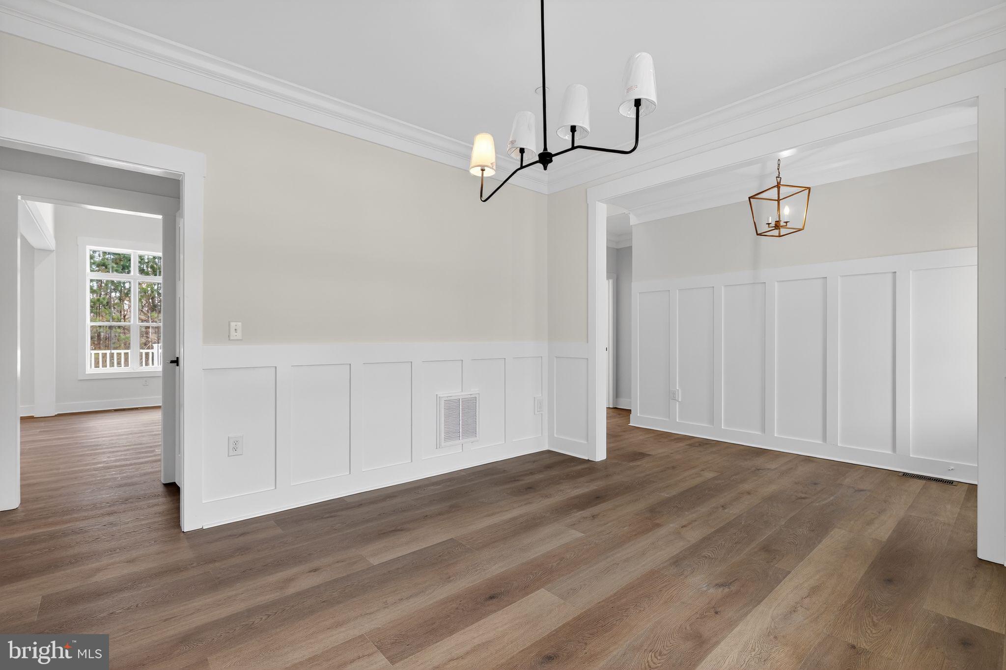 27458 Mooring Way Salisbury, MD 21801 - Photo 5 of 32 a view of empty room with wooden floor and ceiling fan