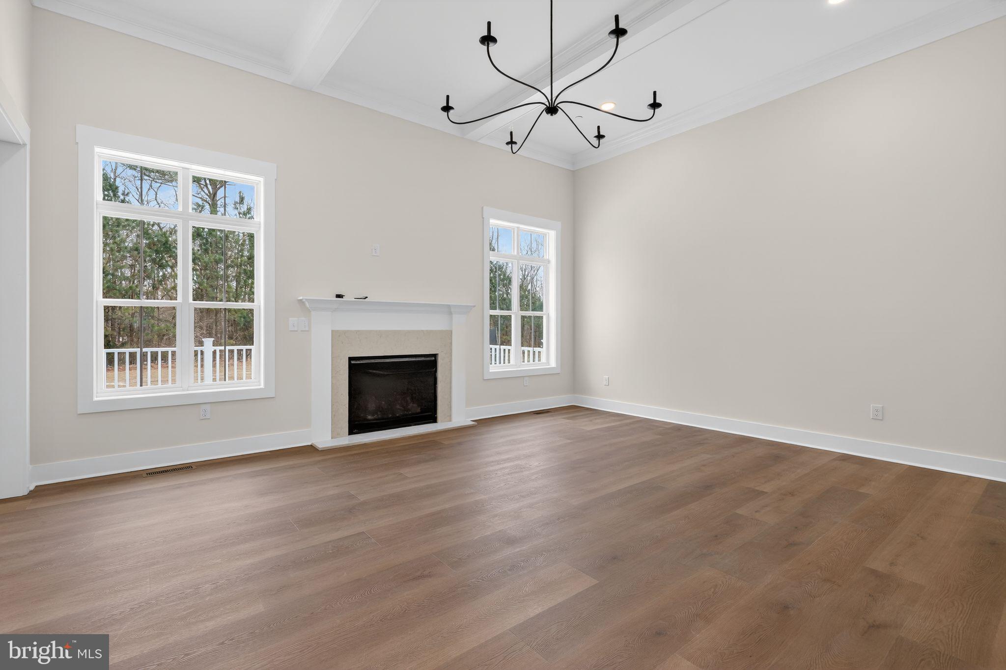 27458 Mooring Way Salisbury, MD 21801 - Photo 8 of 32 a view of an empty room with wooden floor and a window