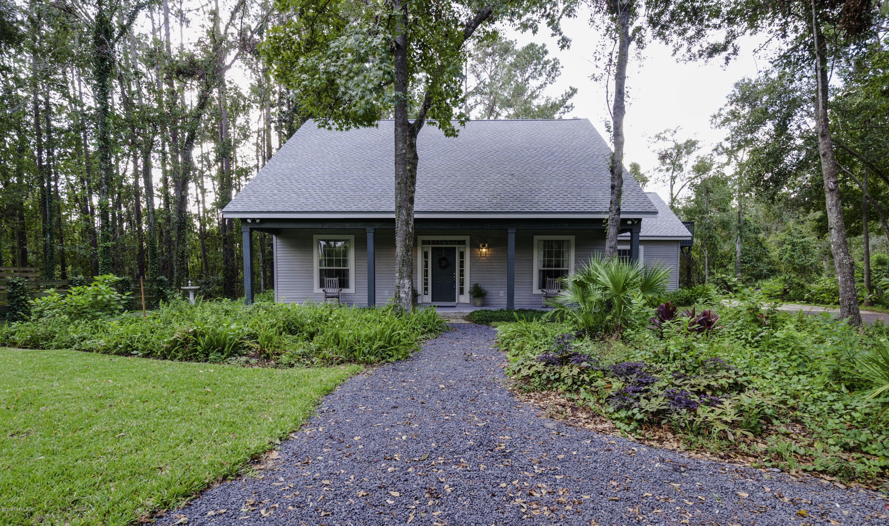 1341 Roberts Road St. Johns, FL 32259 - Photo 1 of 36 a house view with a garden space