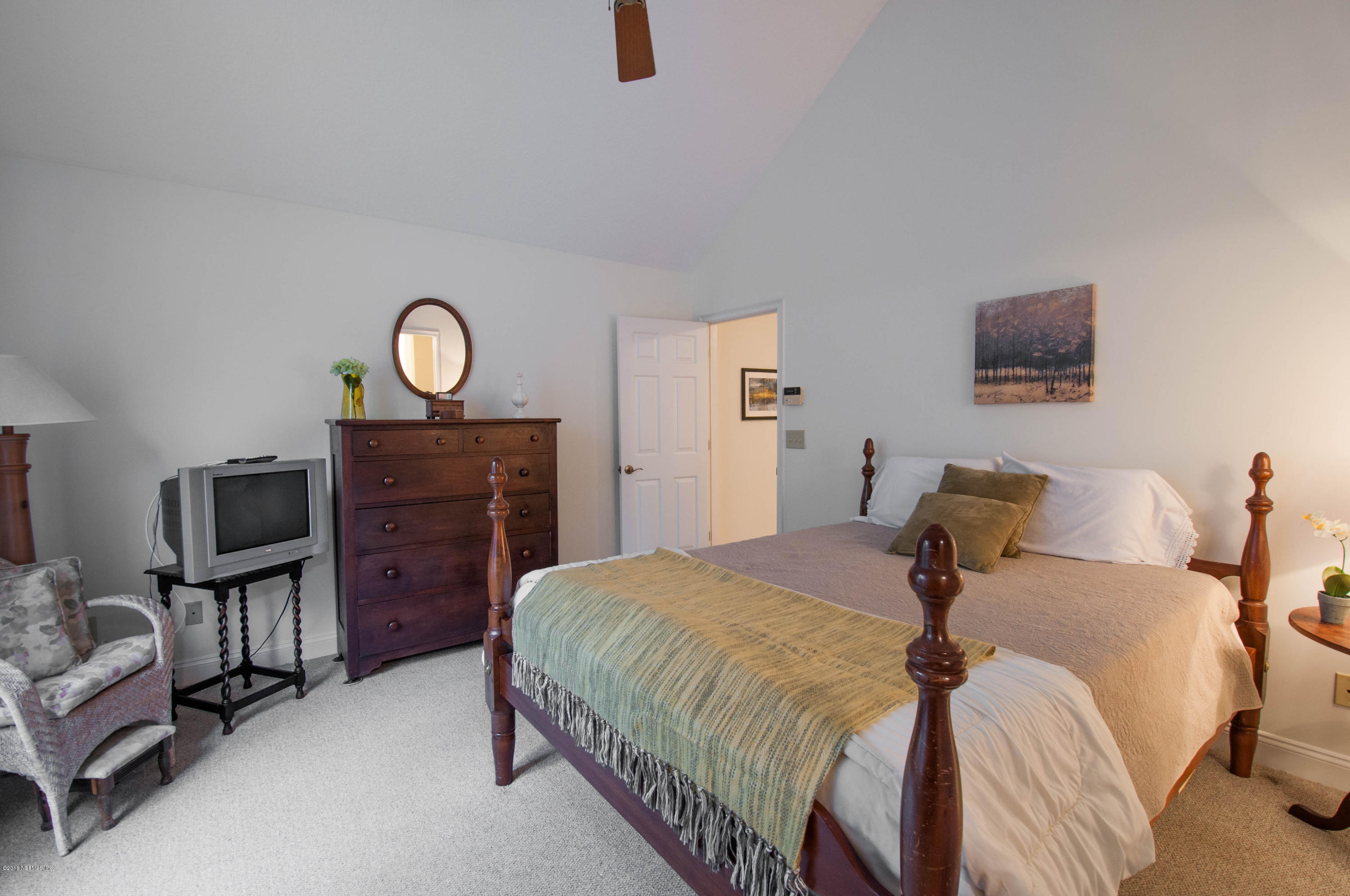 1341 Roberts Road St. Johns, FL 32259 - Photo 16 of 36 a bedroom with a bed furniture and a flat screen tv