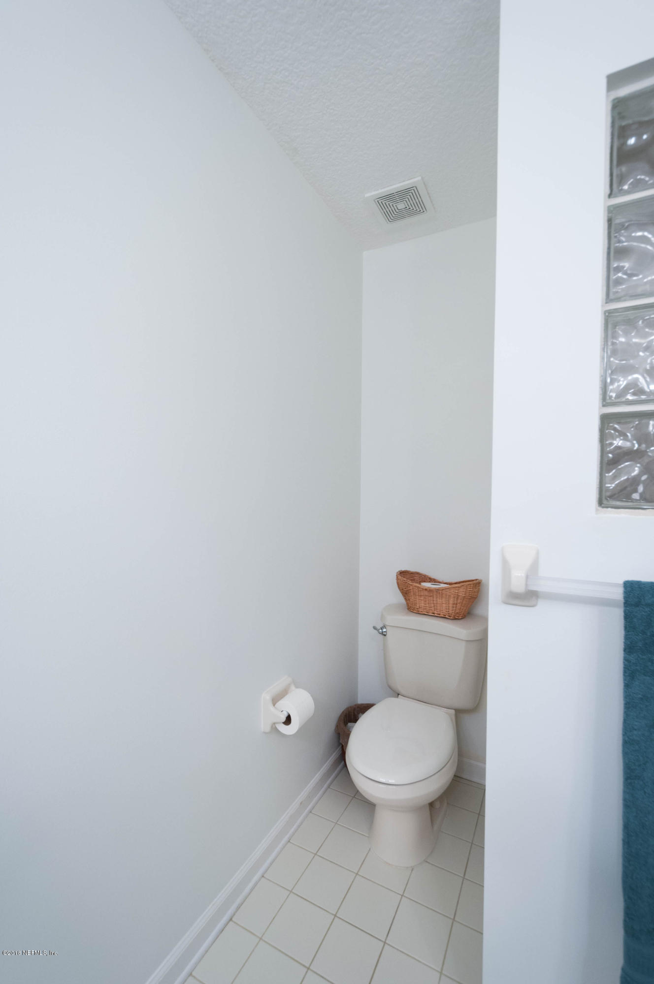 1341 Roberts Road St. Johns, FL 32259 - Photo 18 of 36 a white toilet sitting next to a white cabinet