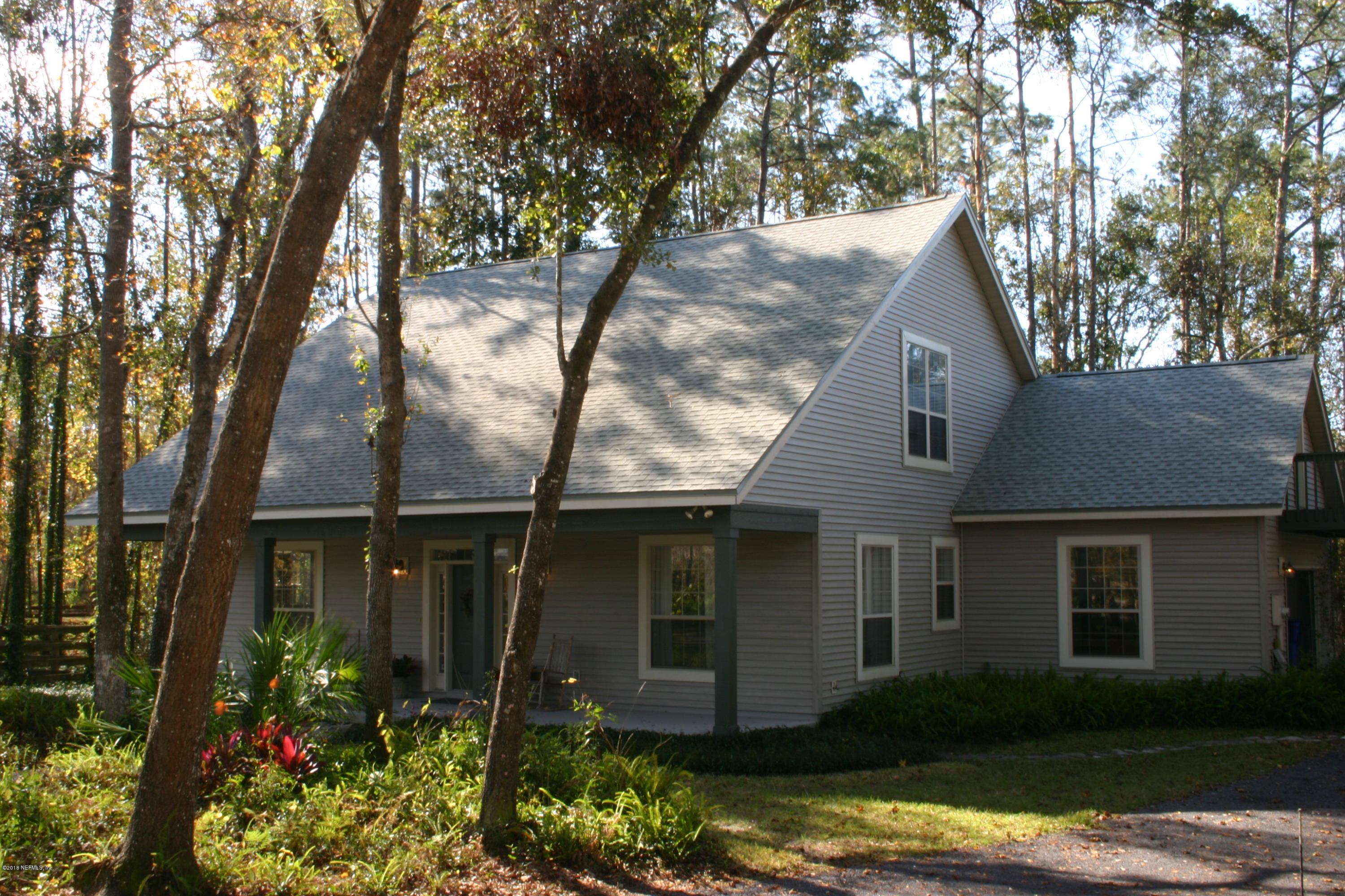 1341 Roberts Road St. Johns, FL 32259 - Photo 2 of 36 a front view of a house with garden