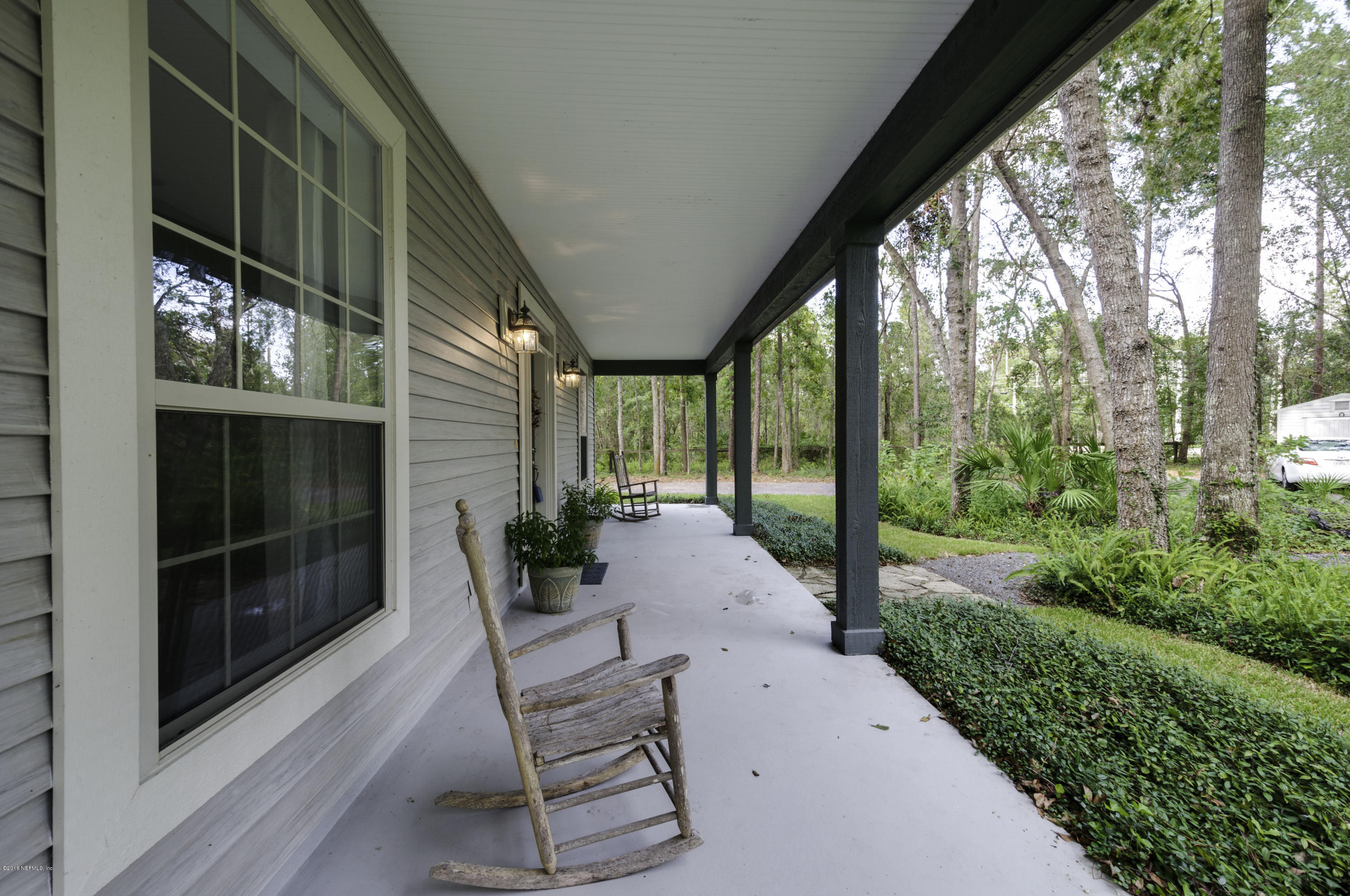 1341 Roberts Road St. Johns, FL 32259 - Photo 3 of 36 a view of a patio with table and chairs and potted plants