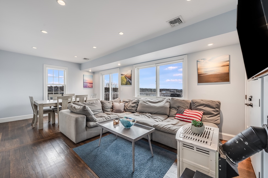17 Silva Court, Unit 3 Gloucester, MA 01930 - Photo 3 of 22 a living room with furniture and a flat screen tv