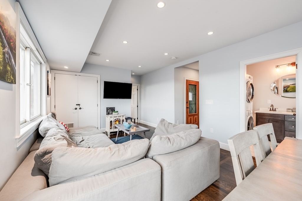 17 Silva Court, Unit 3 Gloucester, MA 01930 - Photo 5 of 22 a living room with furniture and a flat screen tv