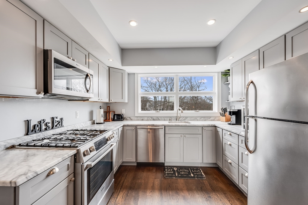 17 Silva Court, Unit 3 Gloucester, MA 01930 - Photo 10 of 22 a kitchen with a stove a sink and a refrigerator