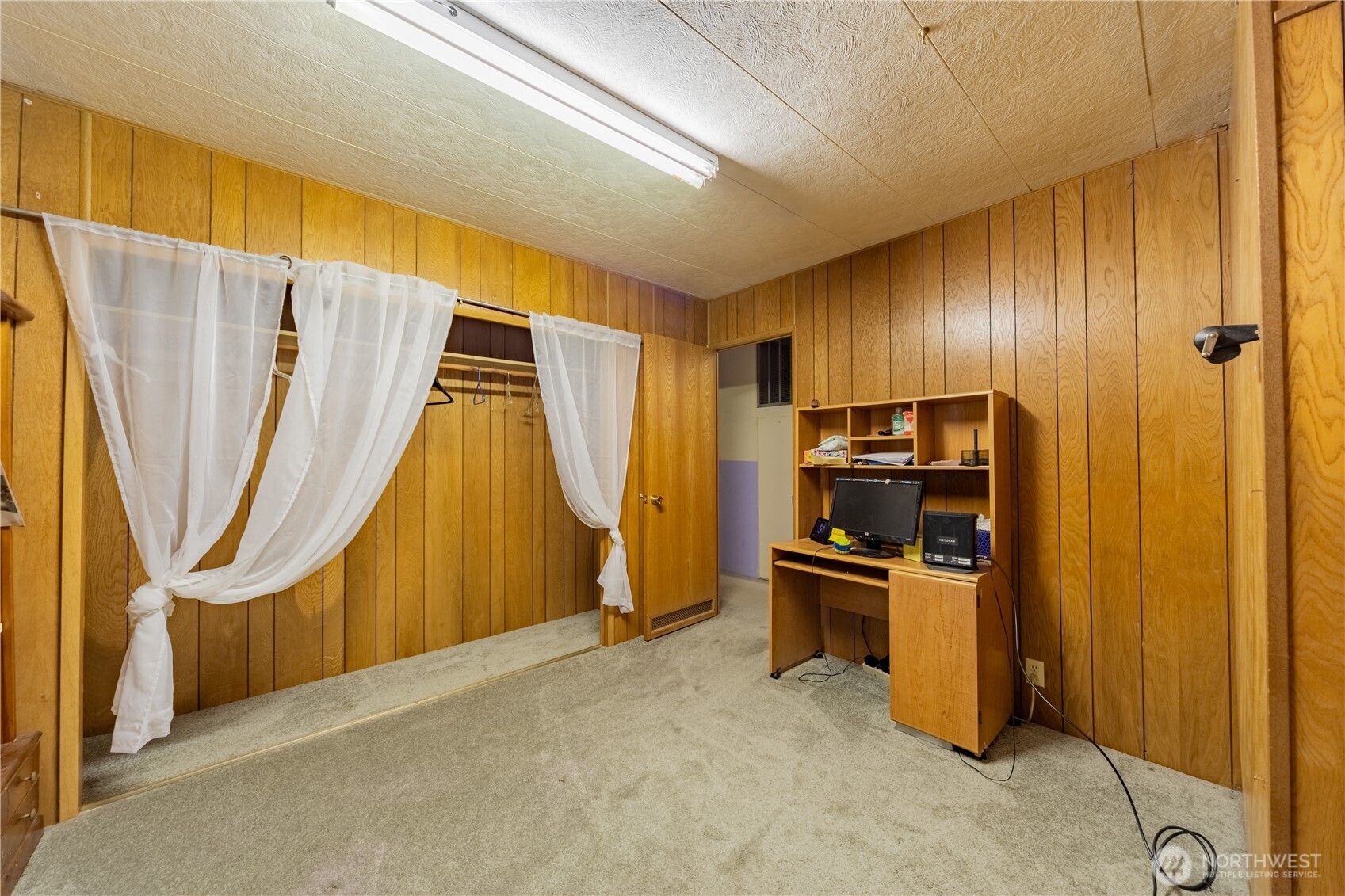930 Trosper Road Southwest, Unit 64 Tumwater, WA 98512 - Photo 19 of 26 a view of a kitchen with a sink and refrigerator