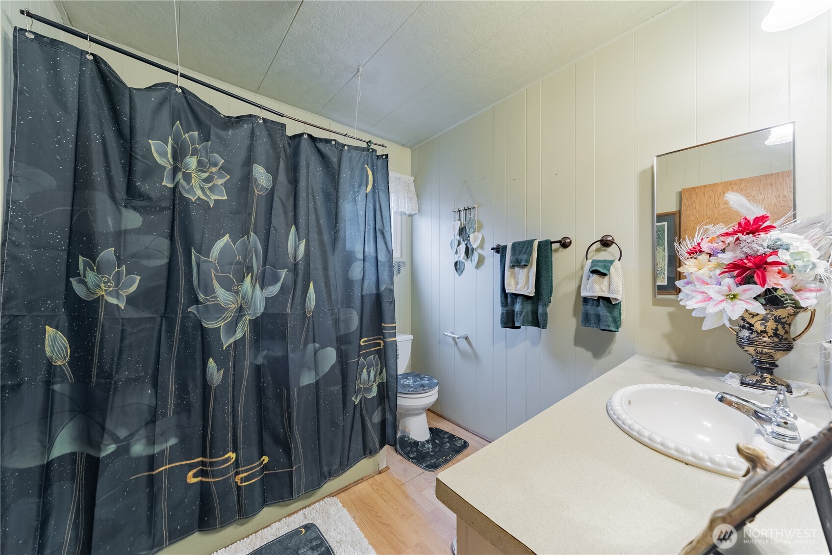 930 Trosper Road Southwest, Unit 64 Tumwater, WA 98512 - Photo 21 of 26 a bathroom with a sink vanity mirror and toilet