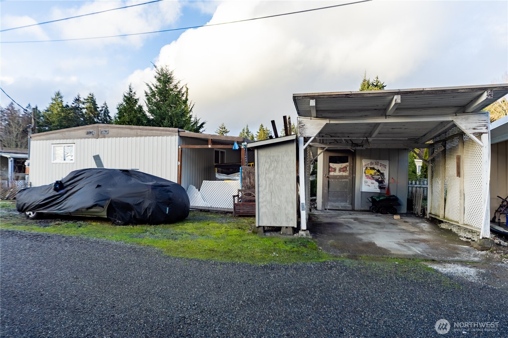 930 Trosper Road Southwest, Unit 64 Tumwater, WA 98512 - Photo 26 of 26 a view of a house with backyard and sitting area