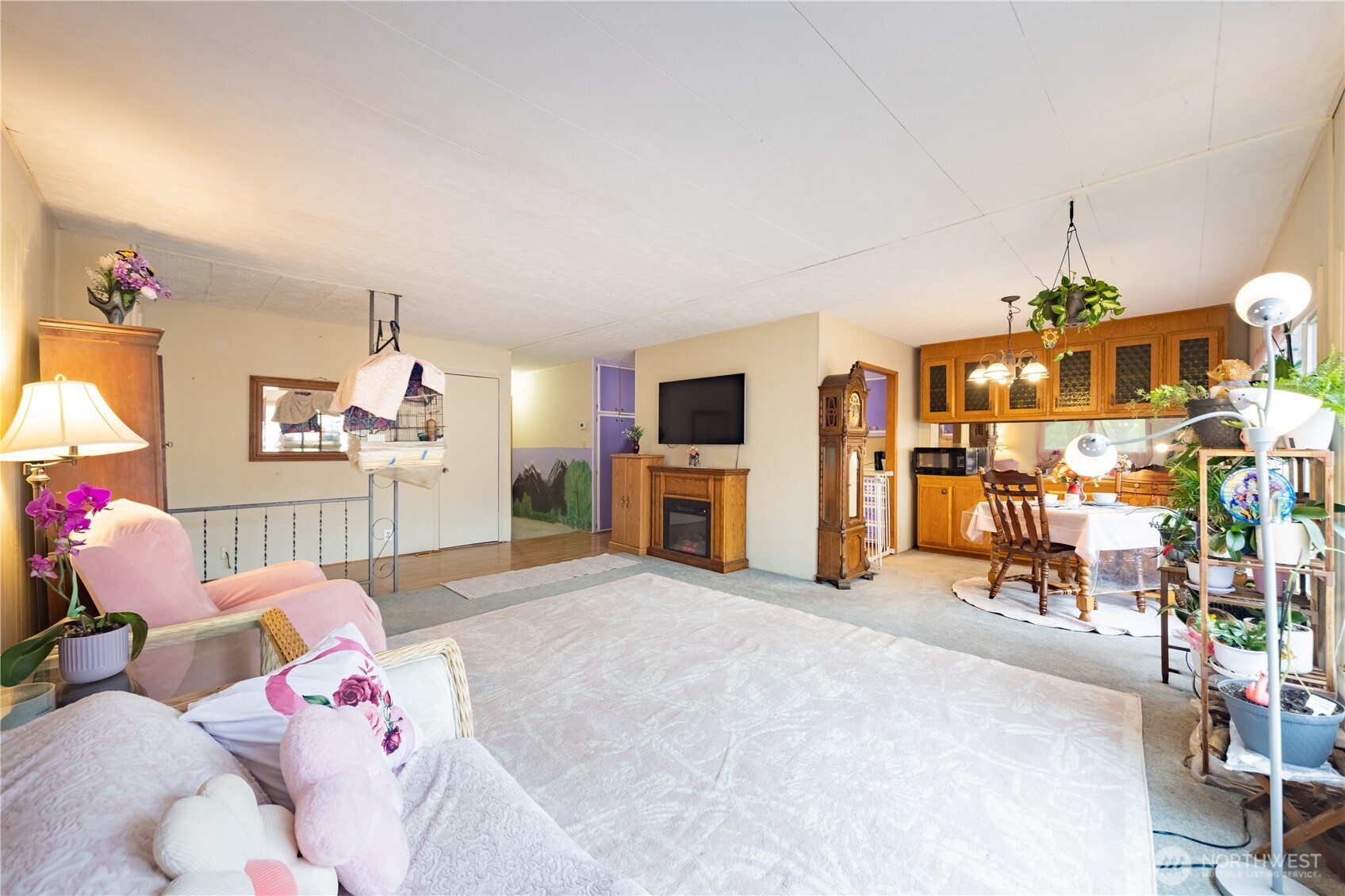 930 Trosper Road Southwest, Unit 64 Tumwater, WA 98512 - Photo 7 of 26 a bedroom with furniture and a flat screen tv