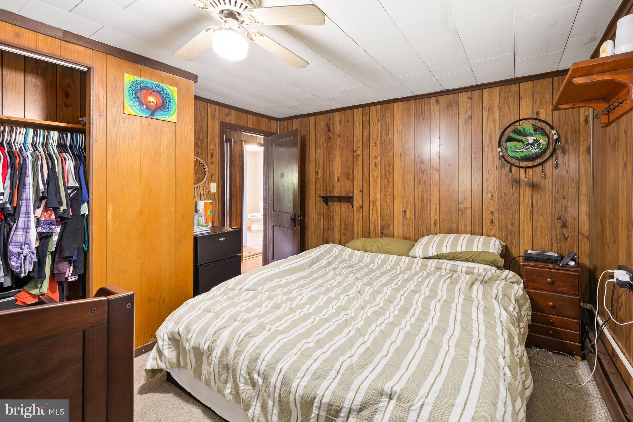 26467 Mariners Road Crisfield, MD 21817 - Photo 38 of 44 a bed sitting in a bedroom next to a window