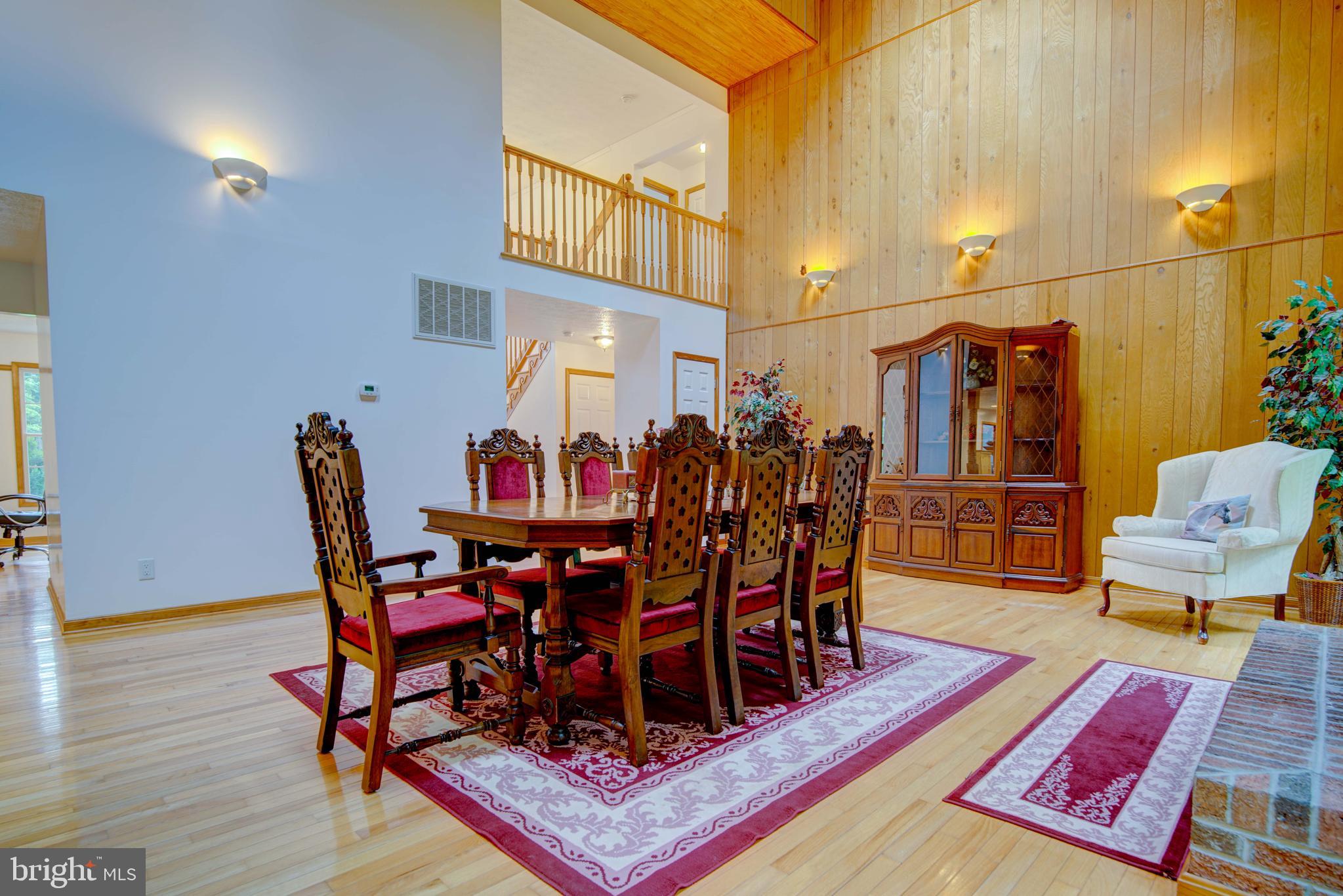 20455 Bowles Road Coltons Point, MD 20626 - Photo 34 of 65 a view of a dining room with furniture and wooden floor