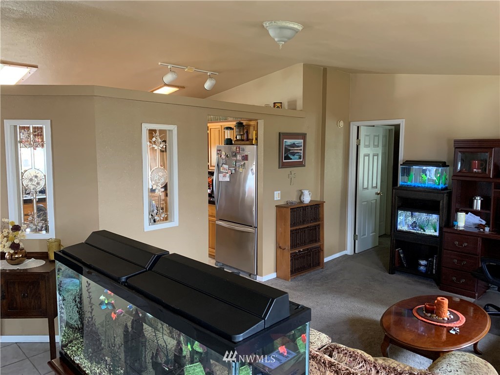 11315 Angeline Road East Bonney Lake, WA 98391 - Photo 3 of 14 a living room with furniture and a wooden floor