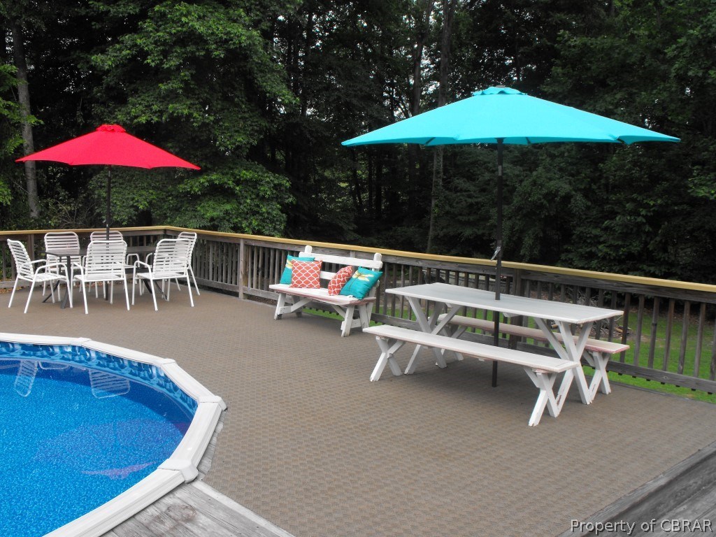 207 Windsor Road Dutton, VA 23050 - Photo 19 of 38 a view of an outdoor sitting area with furniture and umbrella