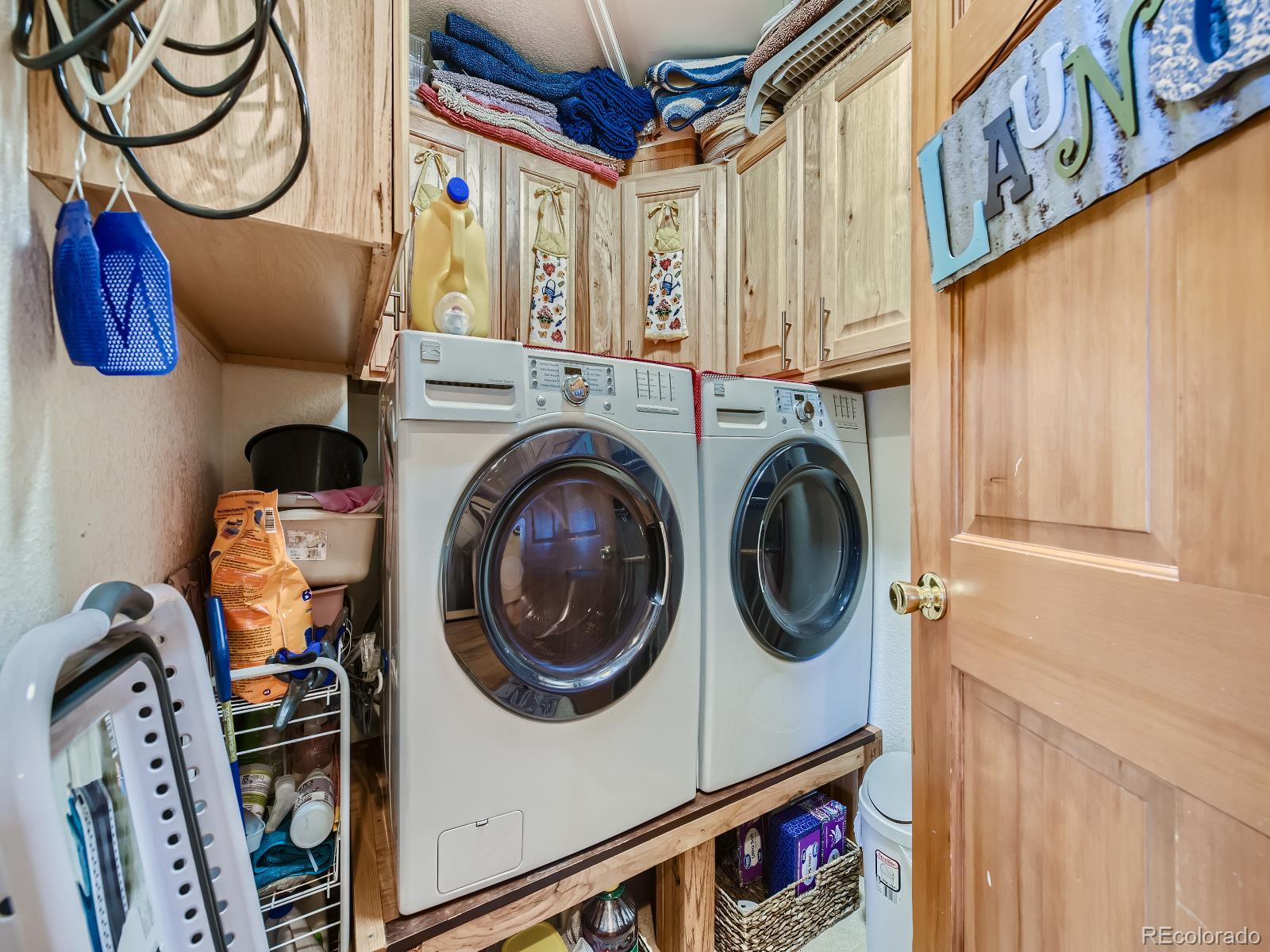 7051 Ski Trail Evergreen, CO 80439 - Photo 11 of 39 a utility room with dryer and washer