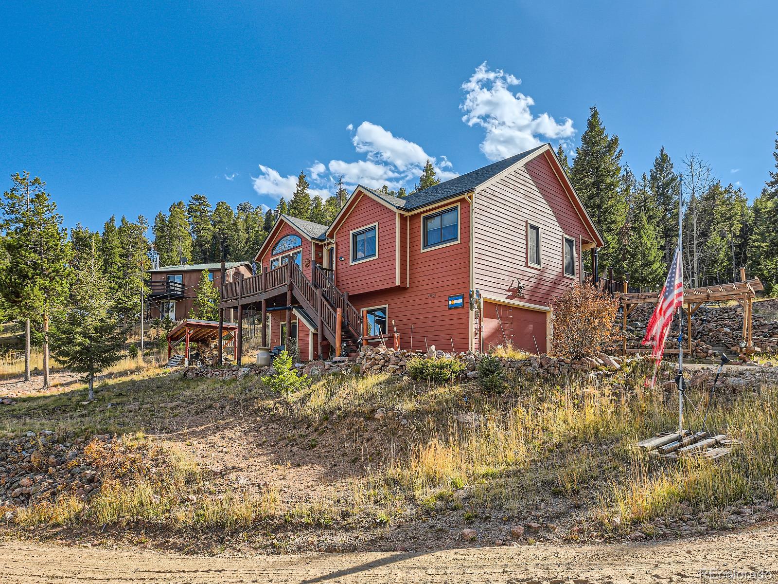 7051 Ski Trail Evergreen, CO 80439 - Photo 24 of 39 a front view of a house with a yard