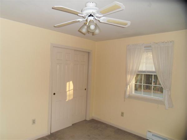 650 Fowler Road Northbridge, MA 01534 - Photo 12 of 15 an empty room with windows and fan