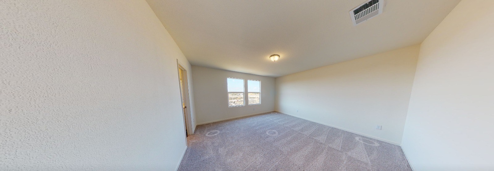 384 Enforcer Loop Jarrell, TX 76537 - Photo 12 of 15 Empty room with light colored carpet and baseboards