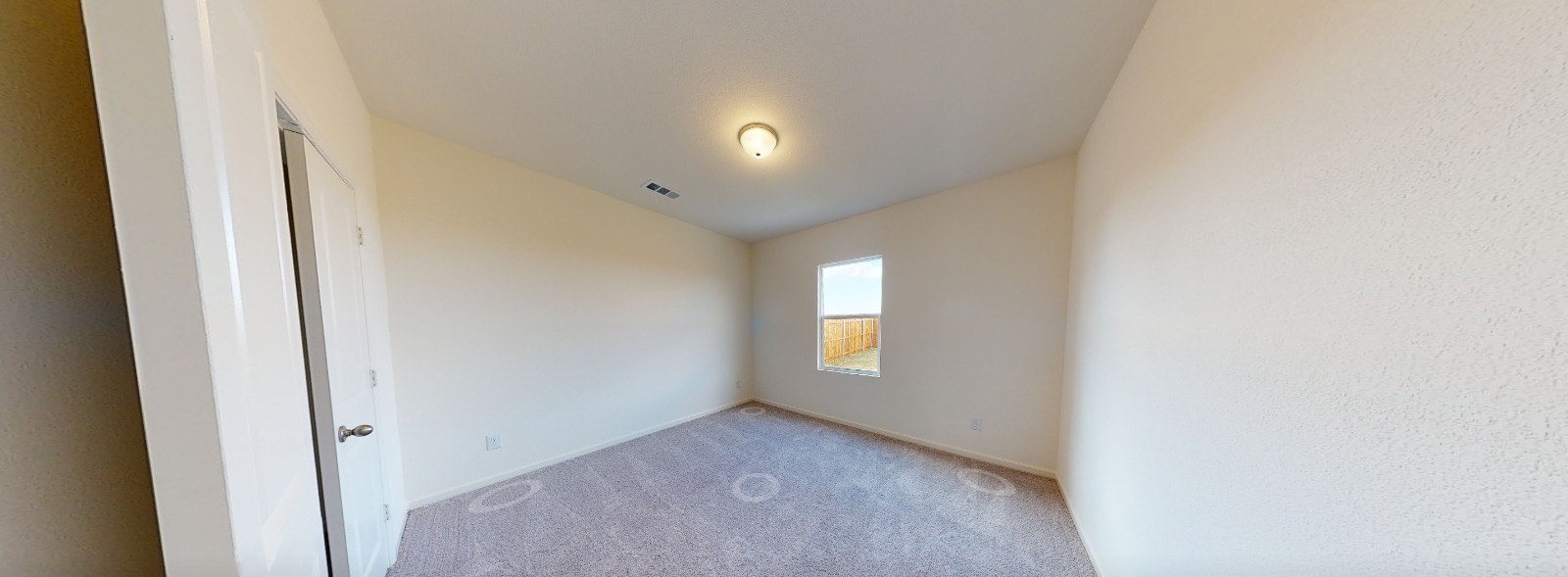 384 Enforcer Loop Jarrell, TX 76537 - Photo 2 of 15 Empty room with carpet floors and lofted ceiling