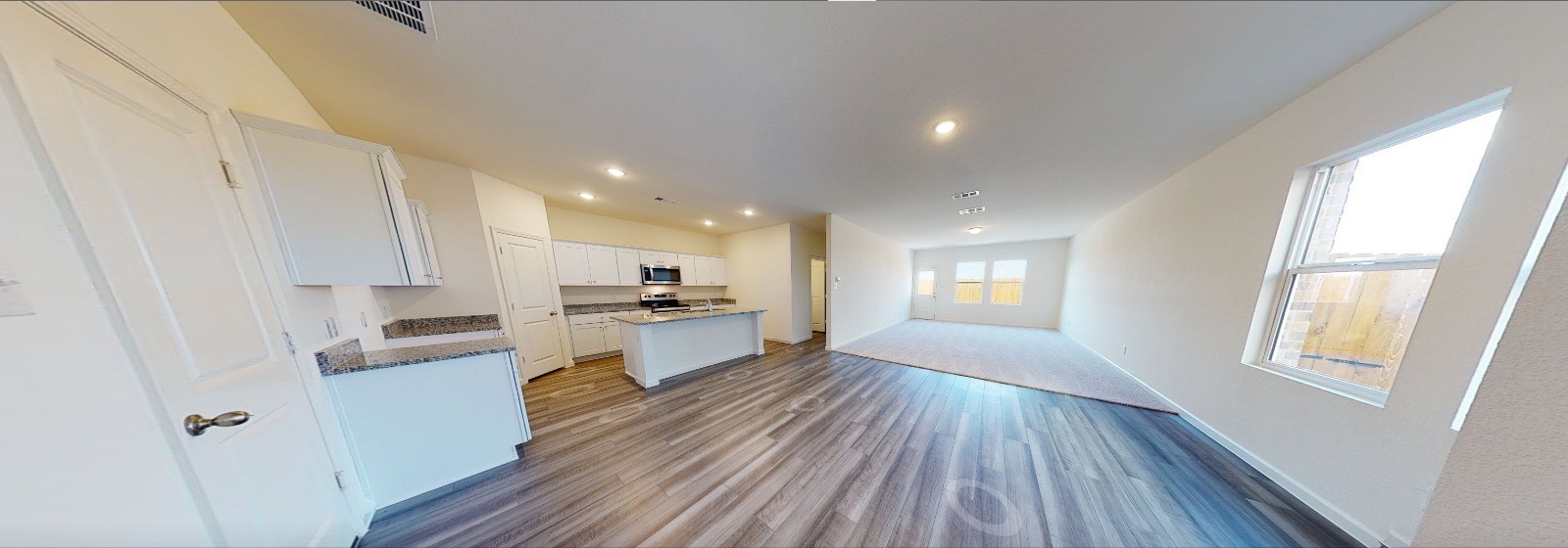 384 Enforcer Loop Jarrell, TX 76537 - Photo 15 of 15 Kitchen with open floor plan, white cabinetry, a kitchen island with sink, dark wood-style floors, and recessed lighting