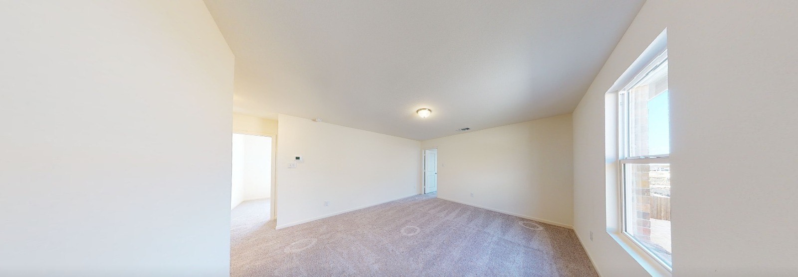 384 Enforcer Loop Jarrell, TX 76537 - Photo 7 of 15 Empty room with carpet flooring and baseboards