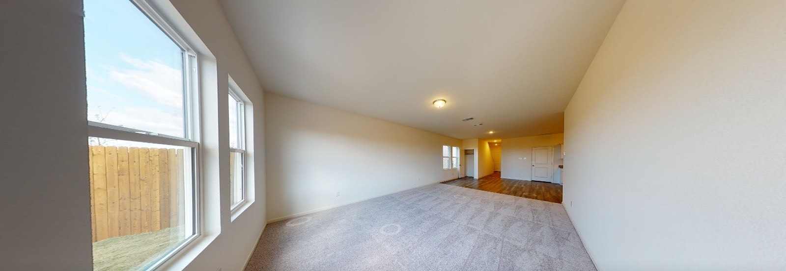 384 Enforcer Loop Jarrell, TX 76537 - Photo 8 of 15 View of carpeted empty room