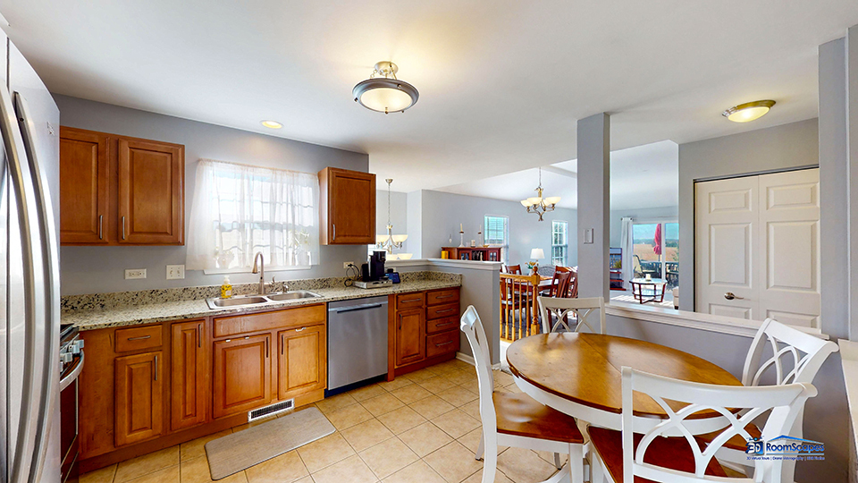 746 Legend Lane McHenry, IL 60050 - Photo 11 of 51 a kitchen with a stove a sink and a refrigerator