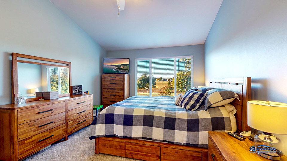 746 Legend Lane McHenry, IL 60050 - Photo 20 of 51 a bedroom with a bed a dresser and chair