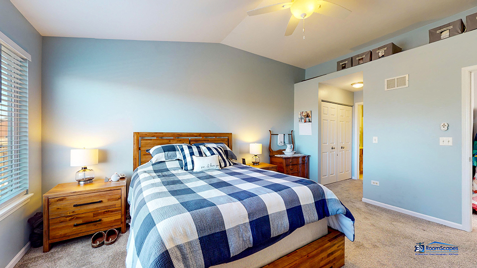 746 Legend Lane McHenry, IL 60050 - Photo 21 of 51 a bedroom with a bed and a chandelier