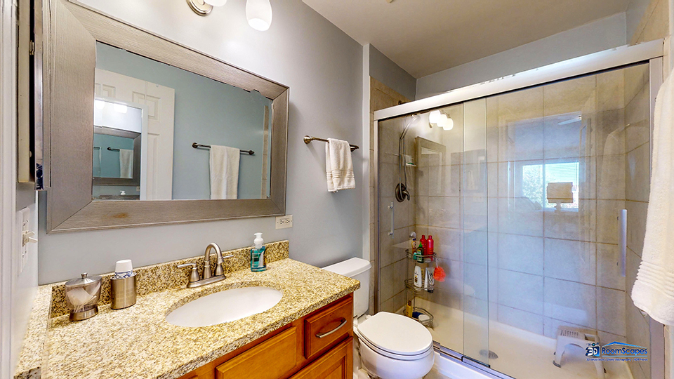 746 Legend Lane McHenry, IL 60050 - Photo 23 of 51 a bathroom with a granite countertop sink toilet a mirror and shower