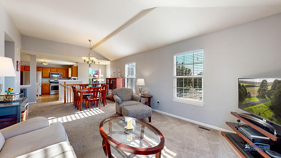 746 Legend Lane McHenry, IL 60050 - Photo 6 of 51 a living room with furniture and a flat screen tv