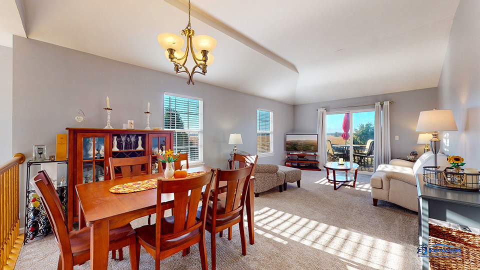 746 Legend Lane McHenry, IL 60050 - Photo 9 of 51 a view of a dining room with furniture a chandelier and a window