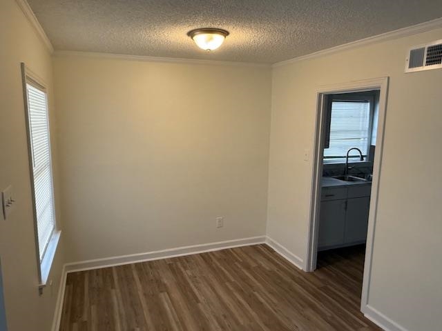 3191 Clarendon Road Memphis, TN 38118 - Photo 3 of 12 a view of an empty room with wooden floor and a window