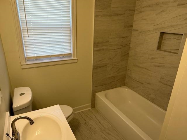 3191 Clarendon Road Memphis, TN 38118 - Photo 10 of 12 a bathroom with a bathtub and shower