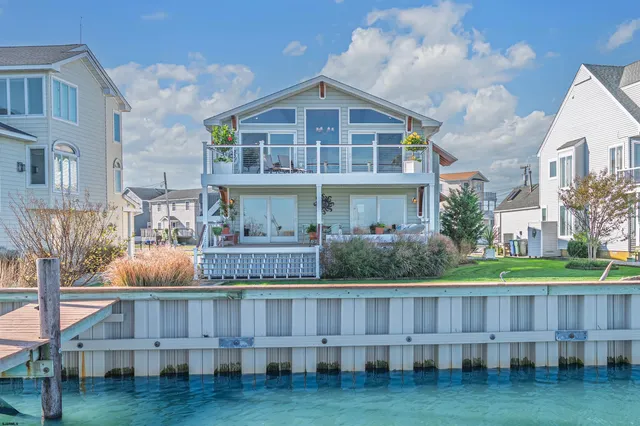 a living room with furniture and potted plant