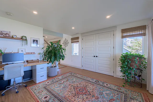 a view of a swimming pool with a table and chairs