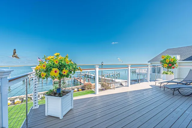 a bathroom with a shower sink vanity mirror and toilet