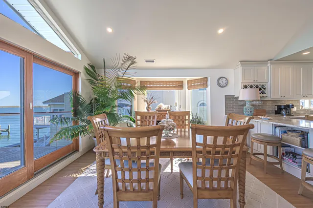 a en suite bathroom with a sink a washer and dryer