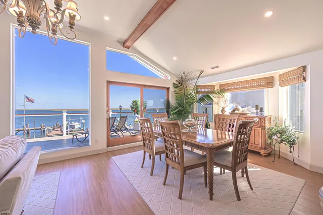 a view of a kitchen with wooden floor and staircase