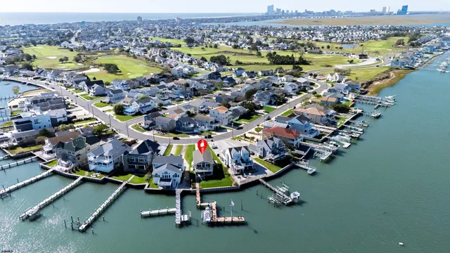 a view of a dining room with furniture and a floor to ceiling window