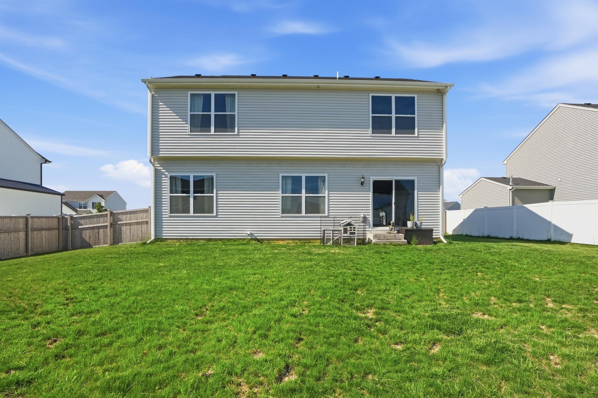 8658 Valley Forge Way Lowell, IN 46356 - Photo 23 of 23 a view of a house with a backyard