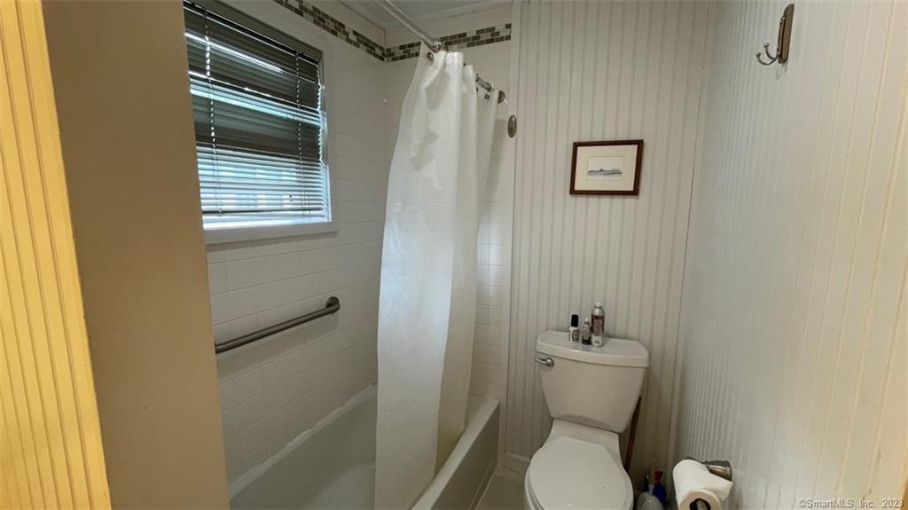 68 Kelsey Place Madison, CT 06443 - Photo 11 of 18 a white toilet sitting next to a bathroom sink