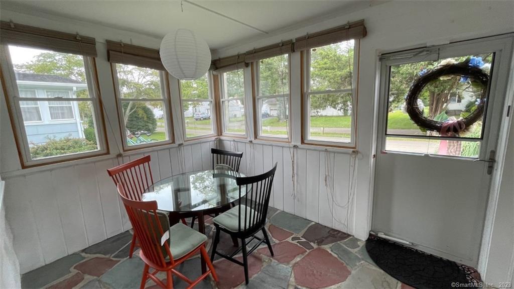 68 Kelsey Place Madison, CT 06443 - Photo 16 of 18 a view of a dining room with furniture window and outside view