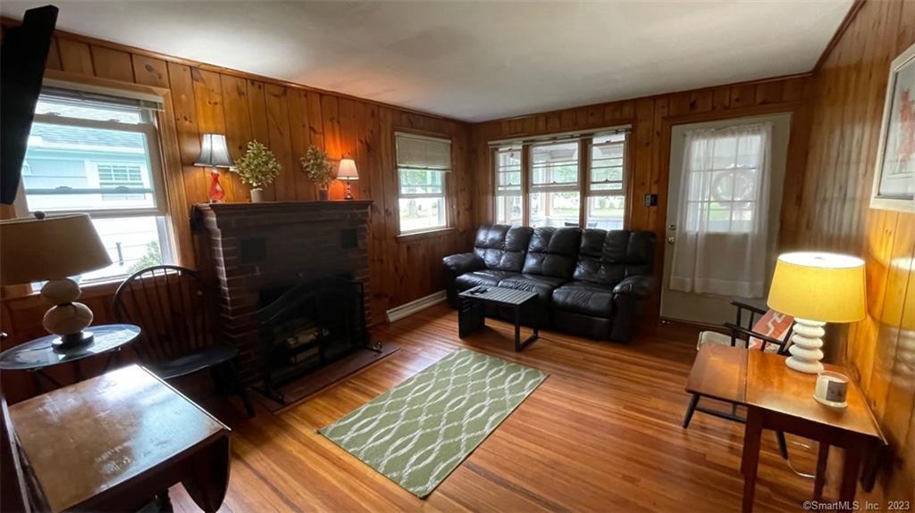 68 Kelsey Place Madison, CT 06443 - Photo 7 of 18 a living room with furniture and a fireplace