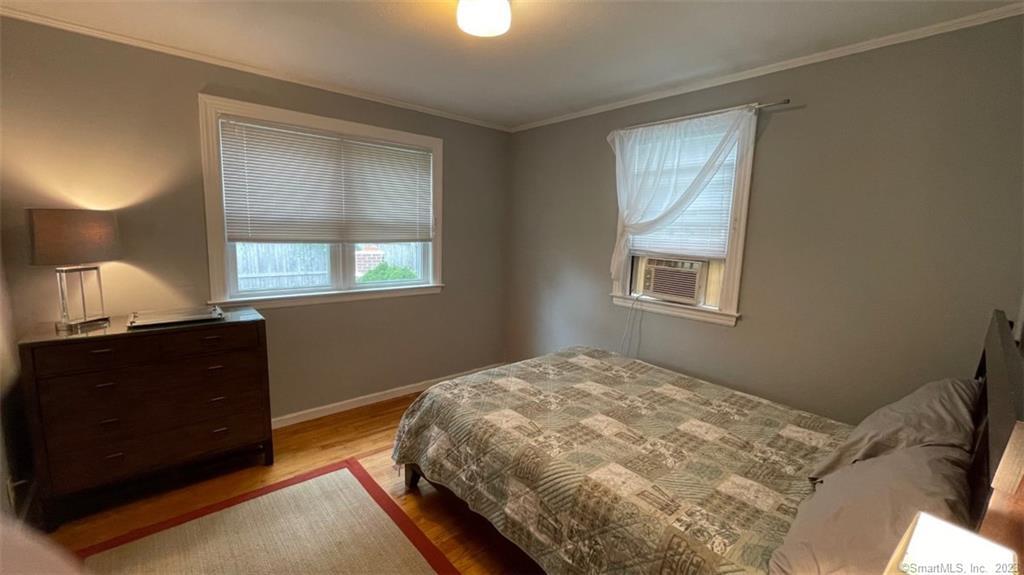 68 Kelsey Place Madison, CT 06443 - Photo 8 of 18 a bedroom with a bed and a window