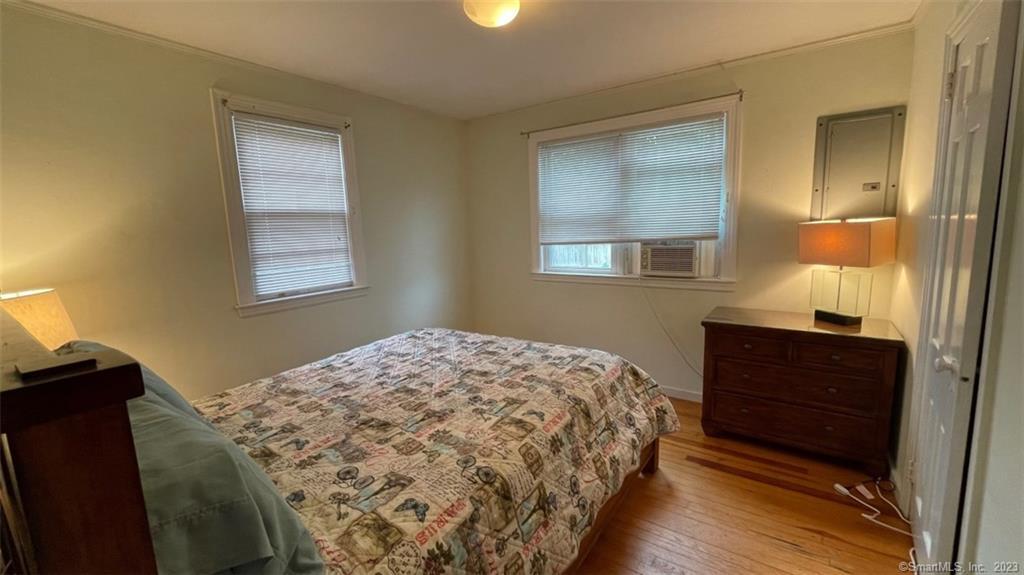 68 Kelsey Place Madison, CT 06443 - Photo 9 of 18 a bedroom with a bed and a window
